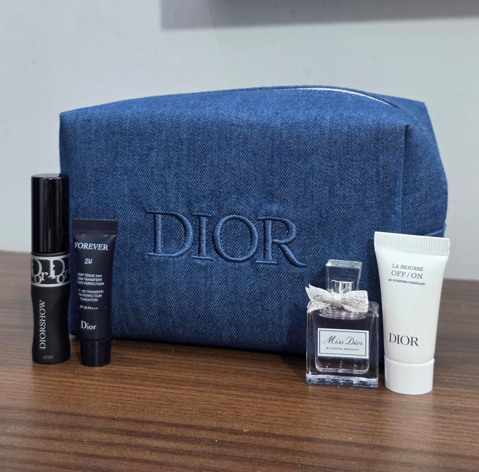 IMG-20251204-WA0109 Dior Cosmetics Fragrance 4-Piece Set with Makeup Bag - Image 1